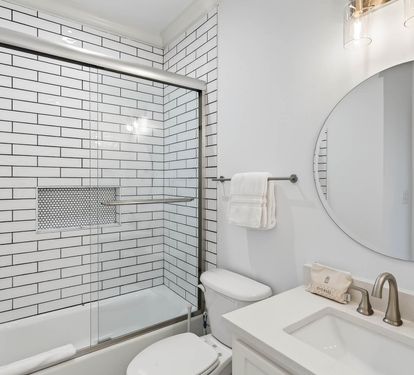 Refresh yourself in this bright, modern bathroom featuring elegant subway tile, spacious tub-shower combo, and premium fixtures for your comfort.