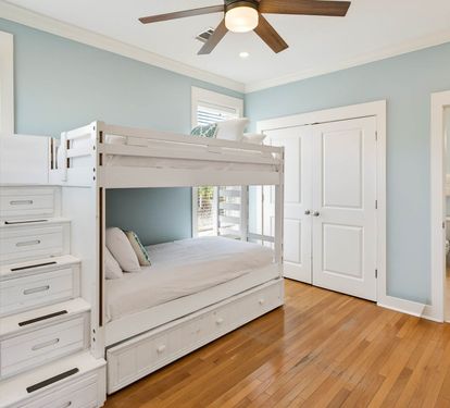 Your bunk bed bedroom offers cozy sleeping for kids with built-in storage stairs and your own private bathroom.
