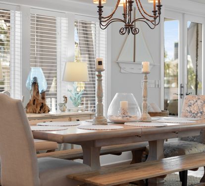 Gather around this elegant dining table where every meal feels like a special occasion with beautiful chandelier lighting.