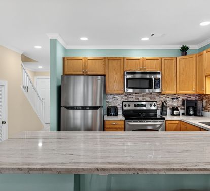 Your fully equipped kitchen features stainless steel appliances, granite countertops, and everything you need to prepare meals during your stay.