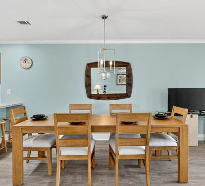 Gather around your spacious dining table for memorable meals, with modern kitchen amenities just steps away and entertainment ready for cozy evenings.