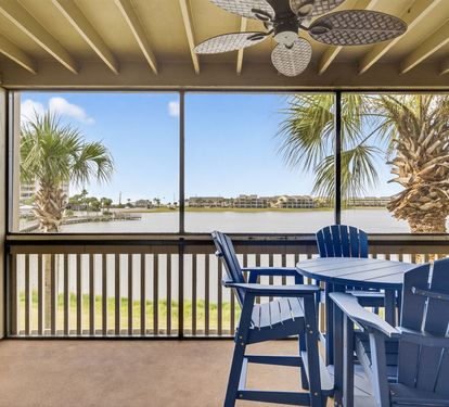 Settle into your private waterfront balcony with comfortable seating where you can enjoy peaceful water views and gentle coastal breezes.