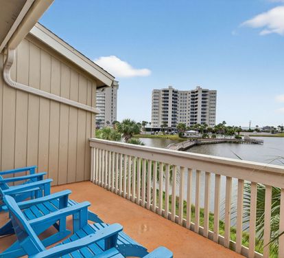Settle into your private balcony with comfortable seating and enjoy peaceful water views perfect for morning coffee or evening relaxation.