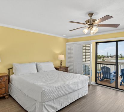 Unwind in your comfortable bedroom featuring crisp linens, warm lighting, and a private balcony where you can step out to enjoy the fresh air and peaceful views.