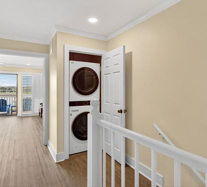 Convenient in-unit laundry with stacked washer and dryer tucked neatly into your hallway closet, making it easy to keep your vacation wardrobe fresh.