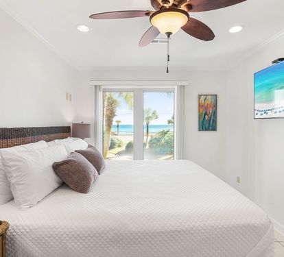 Wake up to stunning ocean views from your comfortable bed. The ceiling fan keeps you cool while you enjoy the coastal scenery.