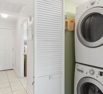 Your convenient in-unit laundry closet keeps fresh clothes just steps away, tucked neatly behind stylish louvered doors for seamless living.