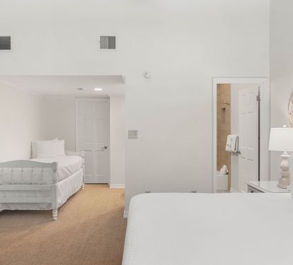Settle into your peaceful bedroom suite with a cozy crib for little ones and elegant vanity area—comfort meets convenience.