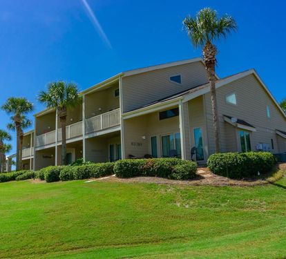 Enjoy easy access to the unit from the private back entrance and patio, offering a relaxing outdoor space perfect for morning coffee or unwinding after the beach.