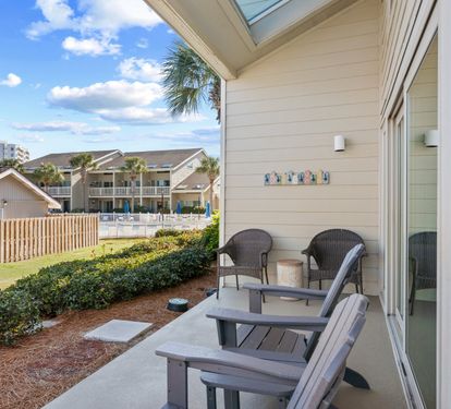 Relax on the private patio with comfortable seating and peaceful coastal surroundings — the perfect spot for morning coffee or winding down after a beach day.