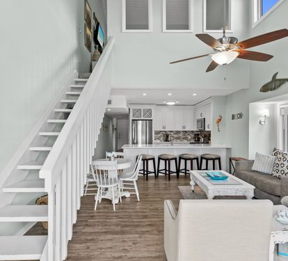 Bright and airy coastal retreat with soaring ceilings, an open-concept layout, and beautifully updated living spaces designed for relaxing, gathering, and enjoying your beach getaway.