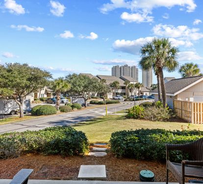 Relax on the private back patio and enjoy peaceful community views, swaying palms, and a laid-back coastal atmosphere throughout your stay.