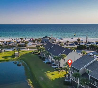 Lakefront villa just steps from the white sand beach! Enjoy the best of both worlds—tranquil water views and quick beach access right across the street.