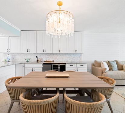 Your stylish dining area flows seamlessly into the modern kitchen, perfect for memorable meals together.