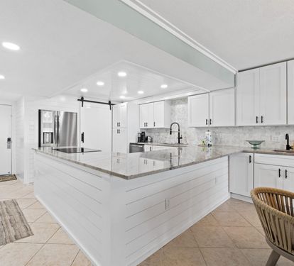 Your gourmet kitchen awaits with gleaming granite countertops, premium stainless appliances, and abundant counter space for memorable meal prep.