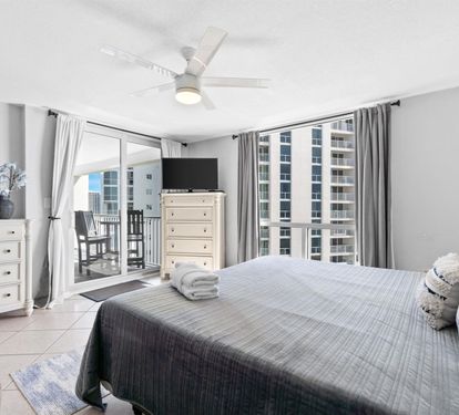 Wake up to stunning city views from your comfortable bedroom with modern amenities and private balcony access.
