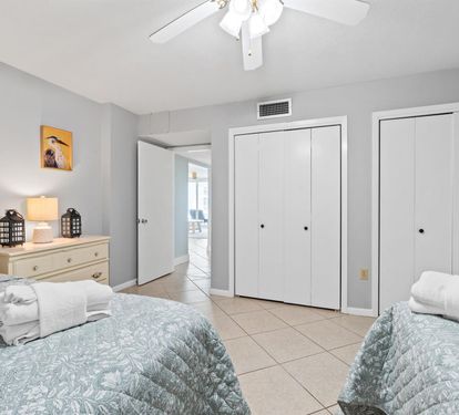 Sleep peacefully in your bright, coastal-themed twin bedroom with ceiling fan and ample closet space for your belongings.