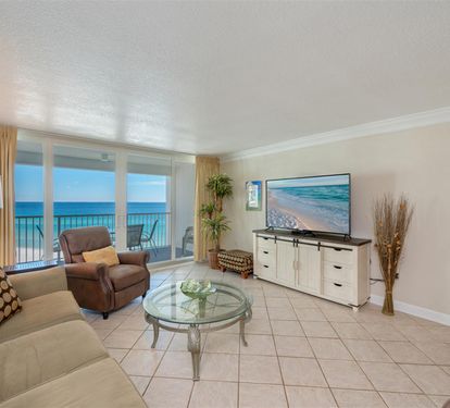 Relax in your oceanfront living room with stunning sea views and beach scenes on the wall-mounted TV.