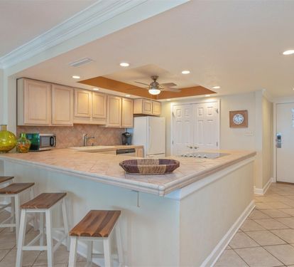 Your spacious kitchen features a breakfast bar perfect for morning coffee and casual meals together.