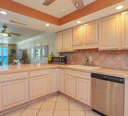Your fully equipped kitchen awaits with stunning ocean views while you cook and unwind in this coastal paradise.