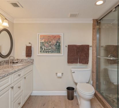 Indulge in your elegant ensuite bathroom with granite counters, rainfall shower, and warm lighting for perfect morning routines.