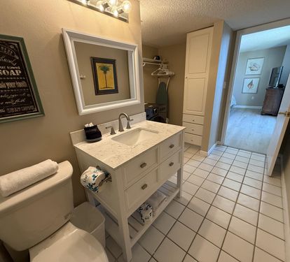 Your spacious bathroom features marble countertops, thoughtful storage, and fresh towels waiting for your arrival.