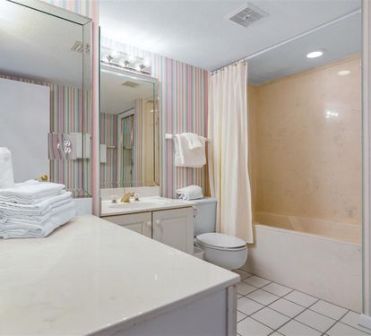 Refresh in your spacious bathroom with ample counter space, fluffy towels, and a full tub-shower combo.