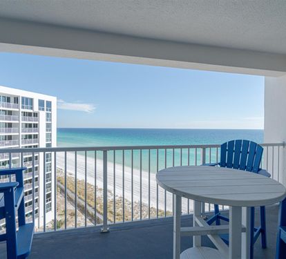 Your private balcony offers stunning ocean views where you can sip morning coffee while watching waves meet pristine white sand below.