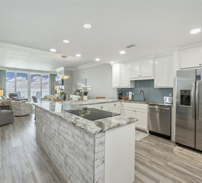Your spacious kitchen flows into the living area, perfect for cooking while chatting with loved ones on your oceanfront getaway.