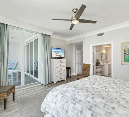Drift into peaceful sleep in your airy bedroom, where soft sea breezes from your private balcony and gentle ceiling fan create the perfect retreat.