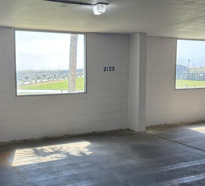Your private parking space offers convenient covered storage with numbered spots and peaceful water views.