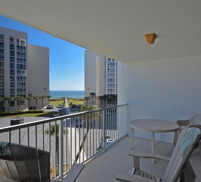 Relax on your private balcony with ocean glimpses between coastal towers, perfect for morning coffee or sunset cocktails.
