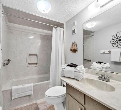 Freshen up in your private bathroom with crisp linens and thoughtful touches for a comfortable stay.
