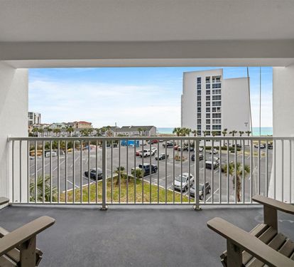Step onto your private balcony with comfortable seating and soak in sweeping views of the coastline and city skyline.