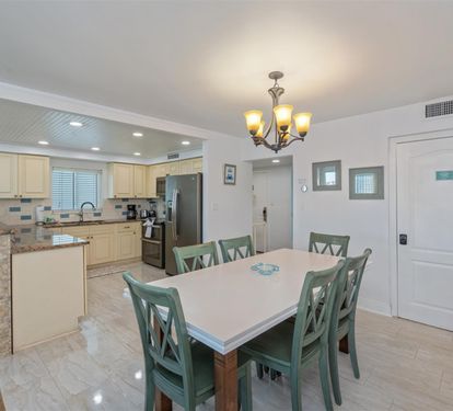 Gather around your spacious dining table for memorable meals while the fully equipped kitchen awaits your culinary adventures.