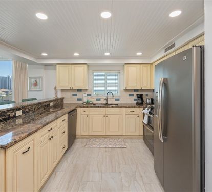 Your fully-equipped kitchen features granite countertops, stainless appliances, and city views to inspire your culinary adventures.