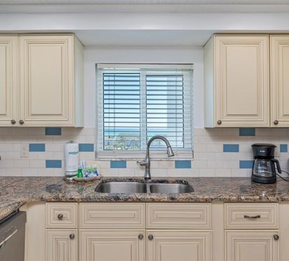 Your fully equipped kitchen features granite countertops, elegant cabinetry, and modern appliances for all your culinary adventures.