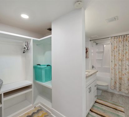 Your spacious bathroom features a full tub-shower combo and thoughtful storage solutions to keep your belongings organized during your stay.
