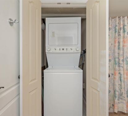 Your in-unit washer and dryer make extended stays effortless, tucked conveniently in this well-designed space.