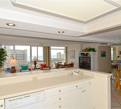 Enjoy sweeping city and ocean views from your elegant open-plan kitchen and living space, where natural light floods through floor-to-ceiling windows.