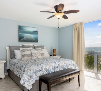 Drift to sleep in this serene coastal bedroom where ocean-inspired blues meet comfort, while your private balcony frames endless views.