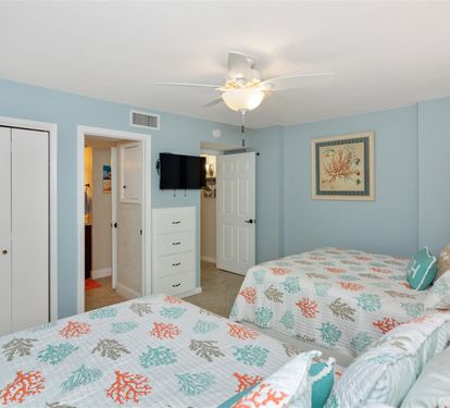 Rest comfortably in your coastal-themed bedroom with twin beds and soothing ocean colors that create a peaceful retreat.