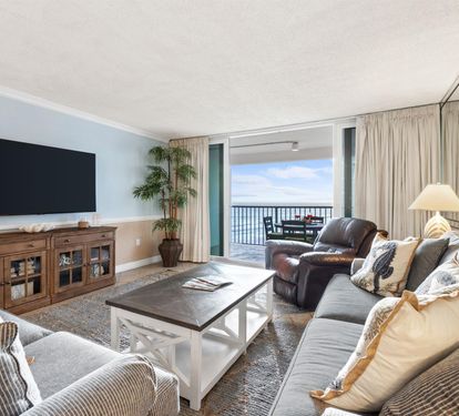 Sink into plush seating while watching your favorite shows on the large TV, with stunning ocean views just steps away on your private balcony.