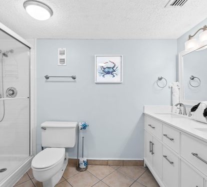 Step into your serene bathroom retreat with a refreshing walk-in shower, modern vanity, and coastal touches that make every morning feel like vacation.