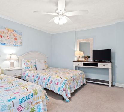 Drift off to sleep in this cheerful twin bedroom, where beach-themed decor and soft blue walls create your perfect coastal retreat.