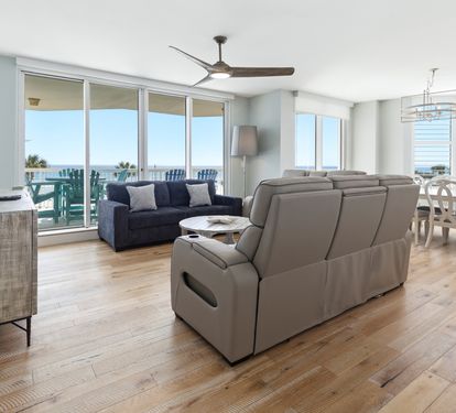 Relax in your modern living space with stunning ocean views and comfortable seating for memorable beach getaway moments.