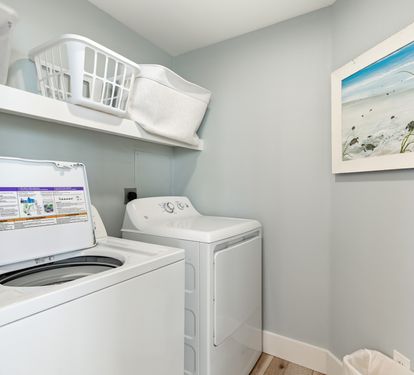 Your private laundry room keeps you comfortable with full-size washer and dryer, plus organized storage for all your vacation essentials.