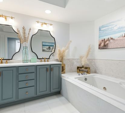Unwind in your spa-like bathroom featuring elegant coastal decor, dual vanities, and a luxurious soaking tub perfect for relaxing after your adventures.