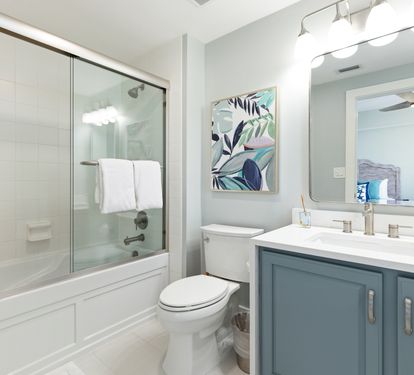 Refresh in your stylish bathroom featuring a spacious tub-shower combo, modern vanity, and bright coastal-inspired decor.