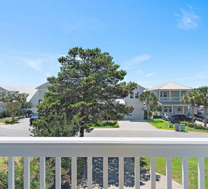 Relax on the balcony overlooking the quiet, beautifully maintained neighborhood.